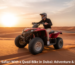 Desert Safari with a Quad Bike in Dubai red dunes at sunset