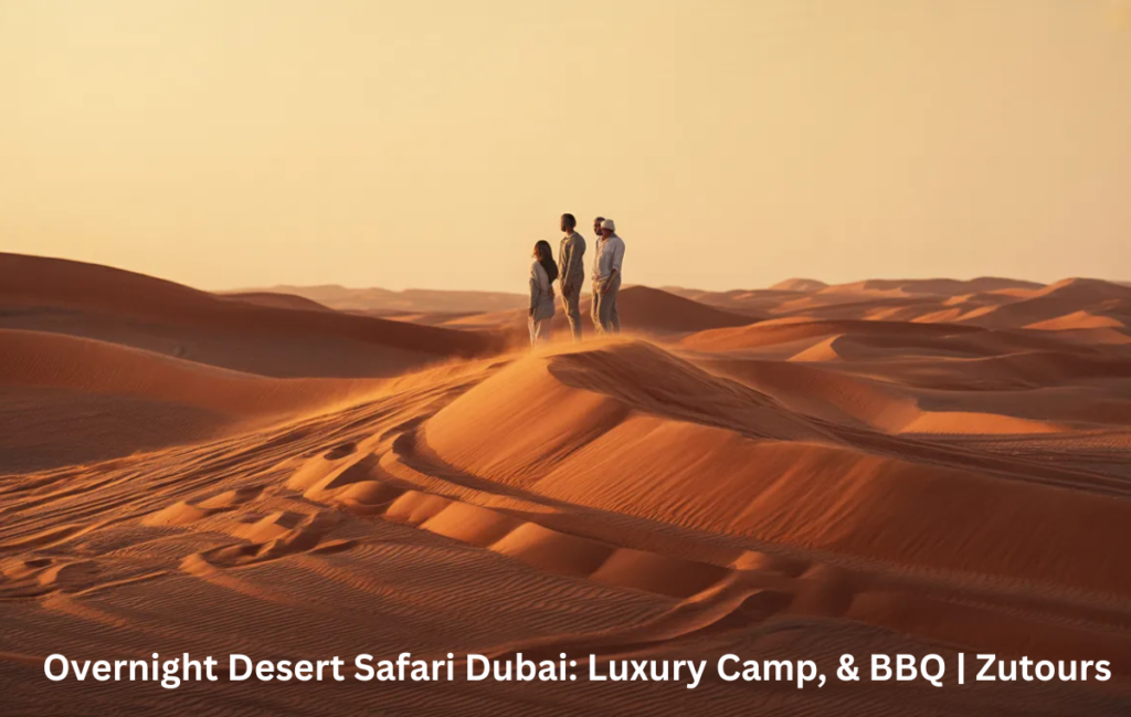 Guests enjoying overnight desert safari Dubai experience in red dunes