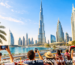 Half day Dubai sightseeing tour with tourists exploring Dubai skyline and Burj Khalifa