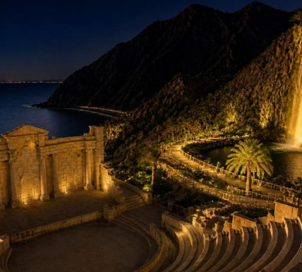 Khor Fakkan Waterfall at Night - Illuminated Evening Views Stunning illuminated Khor Fakkan Waterfall at night with dramatic lighting against the mountain backdrop