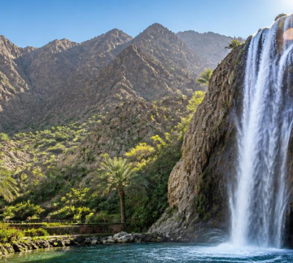 Khor Fakkan Waterfall Tour - Stunning Man-Made Waterfall & Mountain Views Magnificent Khor Fakkan Waterfall cascading against Hajar Mountains backdrop on a sightseeing tour
