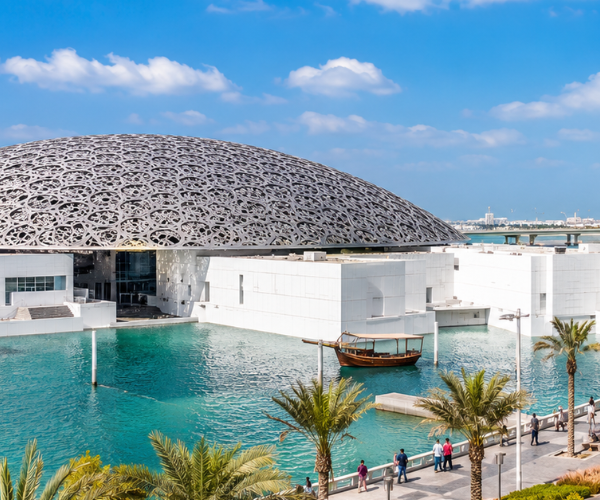 Louvre Abu Dhabi Dome - Private Tour from Dubai Iconic Louvre Abu Dhabi dome and museum exterior on private tour from Dubai with ZuTours