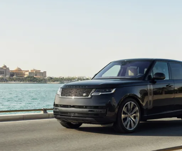 Luxury private vehicle with professional chauffeur ready for a VIP Abu Dhabi city tour