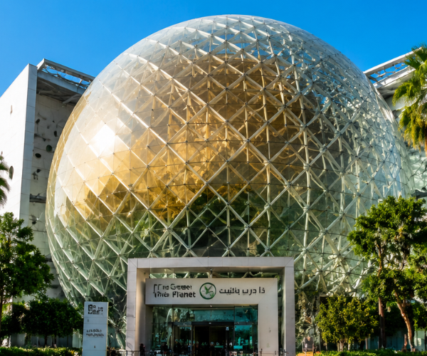 Green Planet Dubai indoor tropical rainforest bio-dome with lush vegetation and exotic wildlife