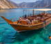 Khasab Musandam dhow cruise sailing through the beautiful Musandam Fjords in Oman