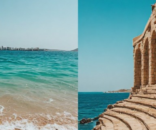 Khor Fakkan Beach and Amphitheatre – East Coast UAE Tour Khor Fakkan Beach with turquoise water and Amphitheatre on coastline during tour from Sharjah