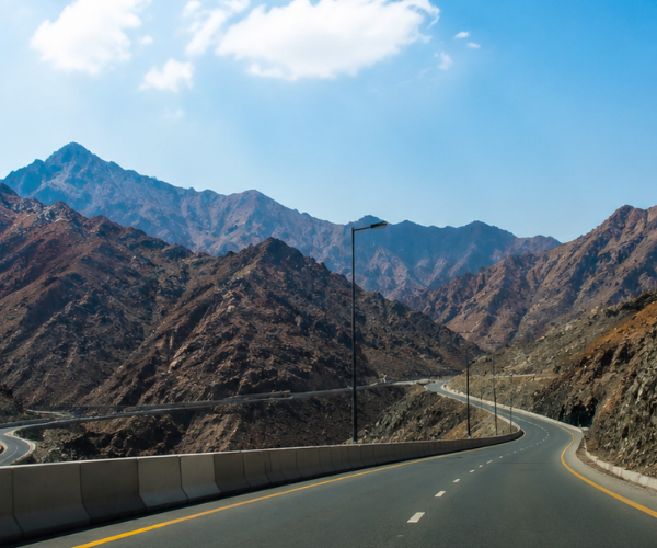Khor Fakkan Tour From Sharjah – Hajar Mountains Scenic Drive Scenic drive through Hajar Mountains on Khor Fakkan tour from Sharjah with dramatic rocky peaks