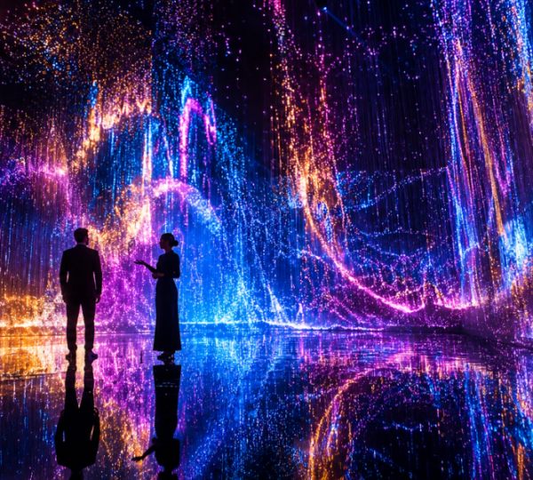 VIP guest exploring teamLab Phenomena Abu Dhabi immersive digital art installation with dedicated host guide at Yas Bay