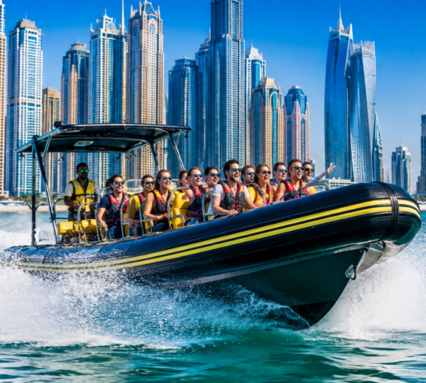 Dubai Marina, Atlantis, Palm & Burj Al Arab Speedboat Tour Speedboat cruising past Dubai Marina skyline with Palm Jumeirah and Burj Al Arab in the background