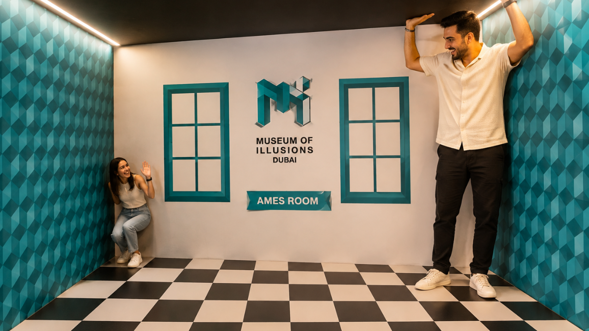 Ames Room at Museum of Illusions Dubai â Size-Defying Photo Spot | Zutours Two people posing in the Ames Room at Museum of Illusions Dubai where one appears giant and the other tiny due to distorted-perspective illusion