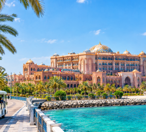 Emirates Palace & Corniche – Full Day Abu Dhabi Tour | Zutours Emirates Palace hotel and Abu Dhabi Corniche waterfront on a full-day sightseeing tour from Dubai with turquoise sea views